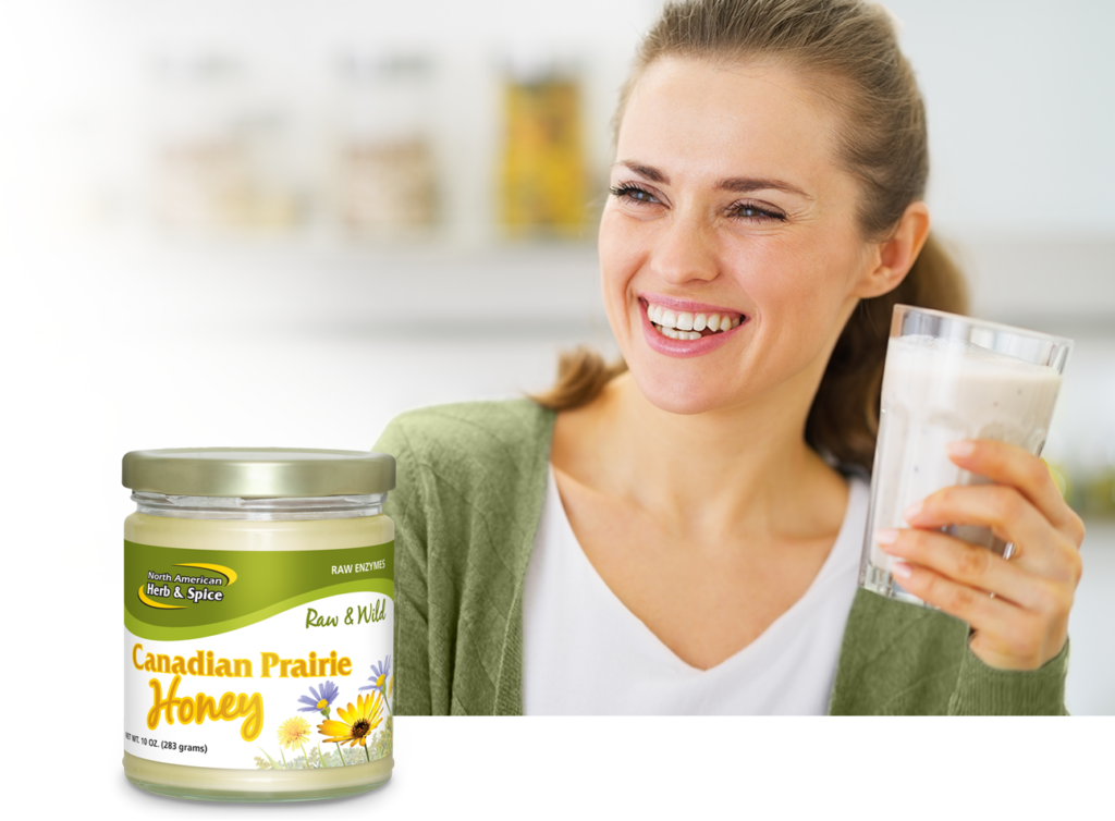 Woman enjoying a smoothie with Canadian Prairie Honey product